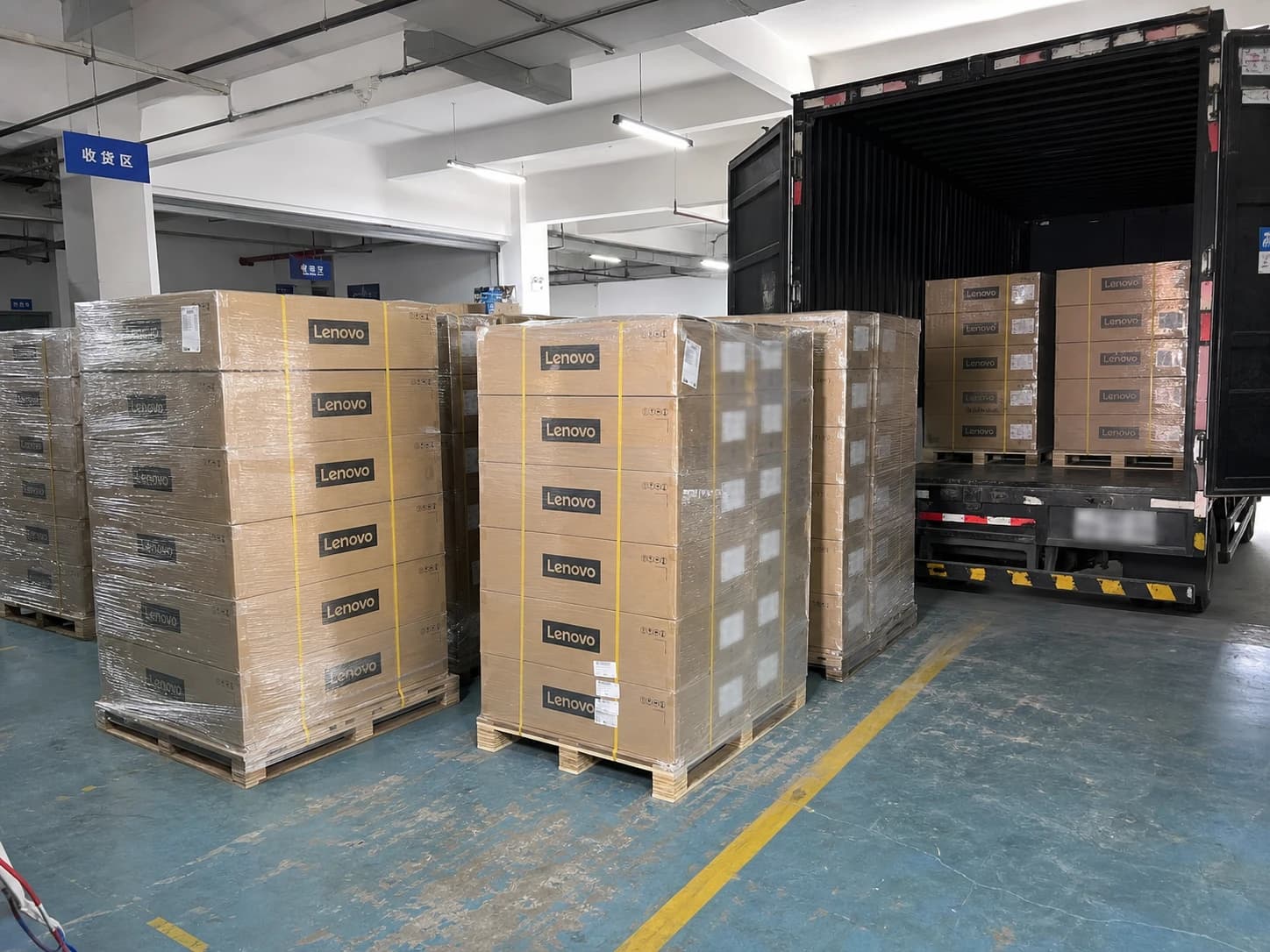 Lenovo pallets beside receiving truck