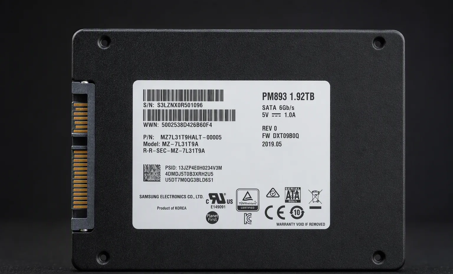 Samsung PM893 1.92TB enterprise SATA 2.5 inch SSD, label view, dark studio macro product shot.