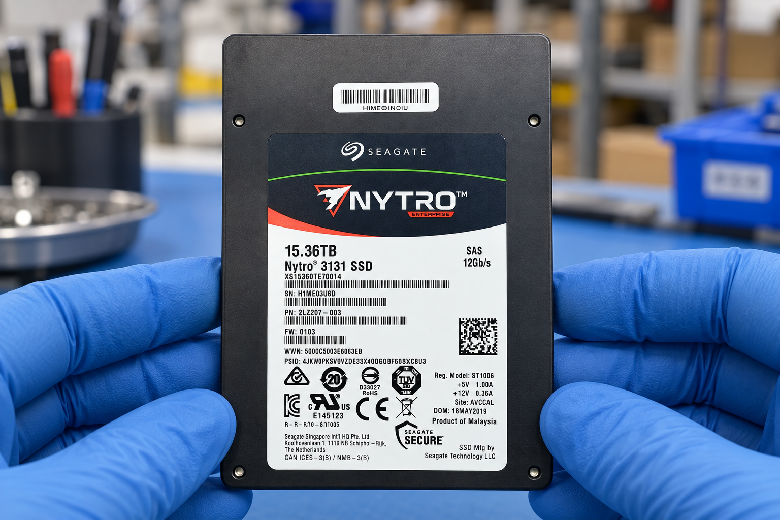 Seagate XS15360TE70014 held by two blue-gloved hands above a blue electronics workbench; generated scene